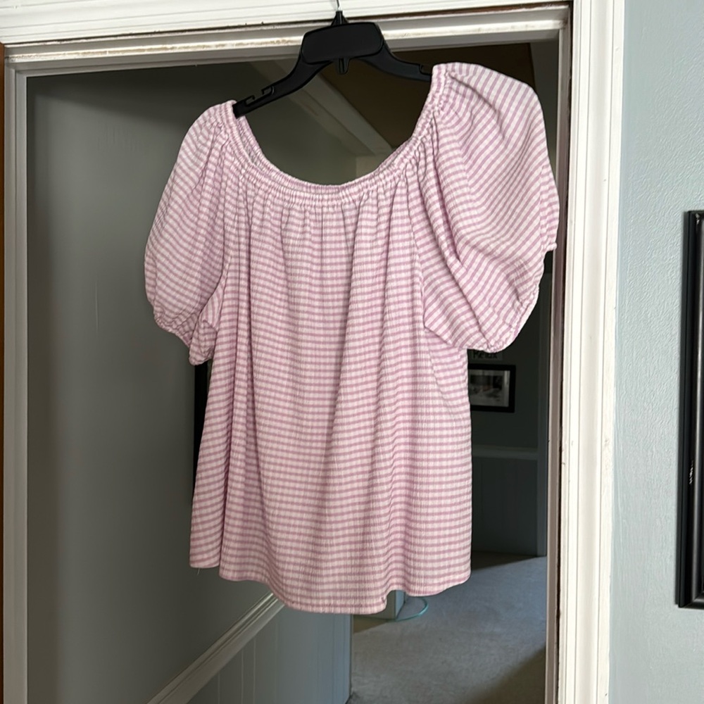 Purple and white striped shirt.